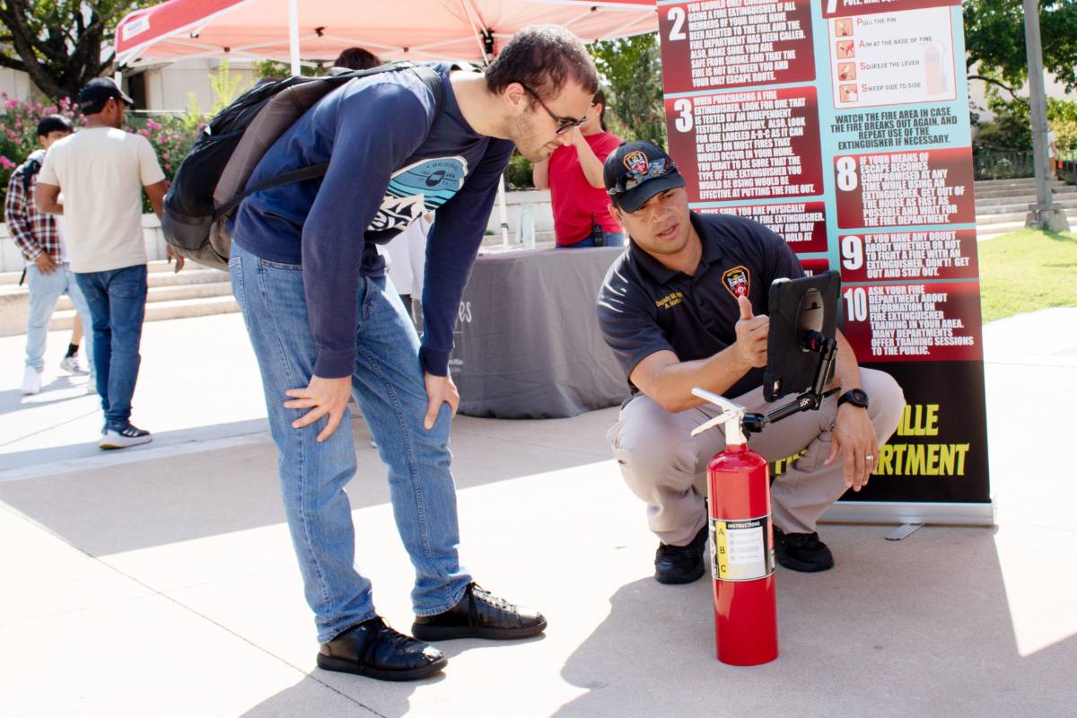 Man showing a student safety resources